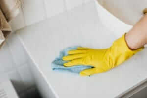 A hand with cleaning gloves