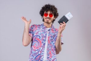 A guy with tourist visa ticket and passport in hand