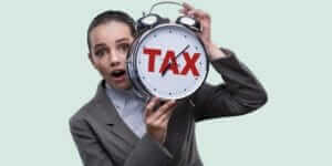 A girl with tax alarm clock