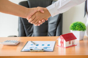 hand shake upon a property selling deal