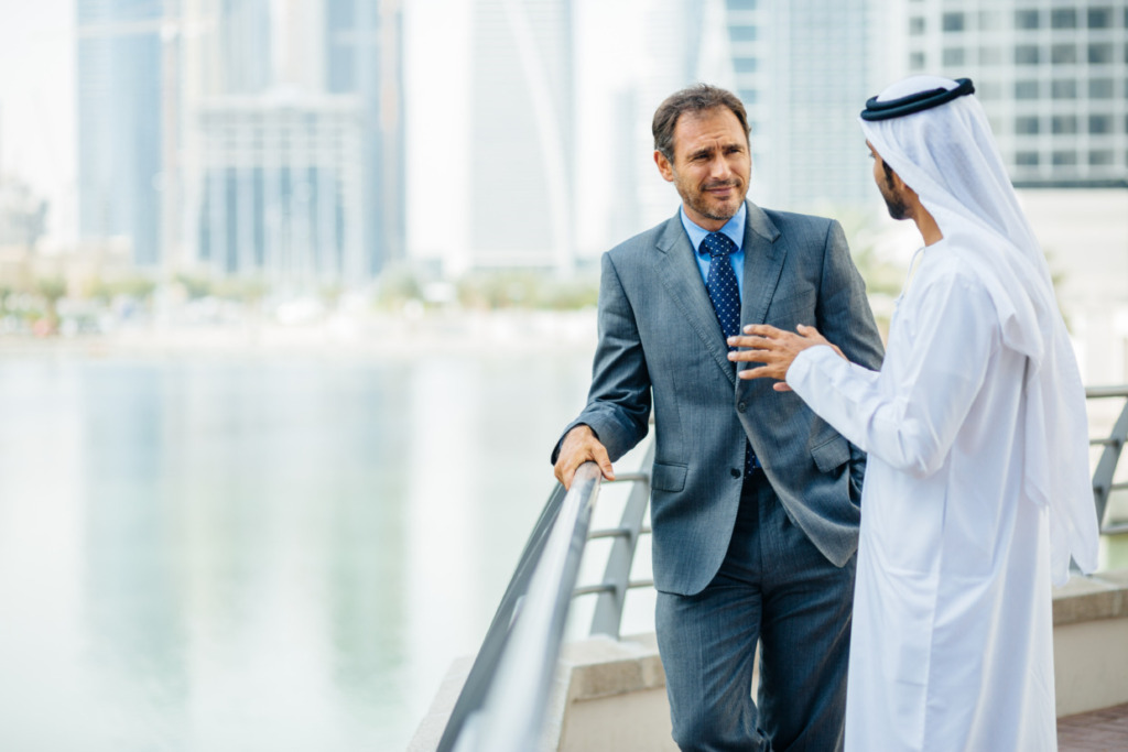 An employee in a meeting with a UAE national.
