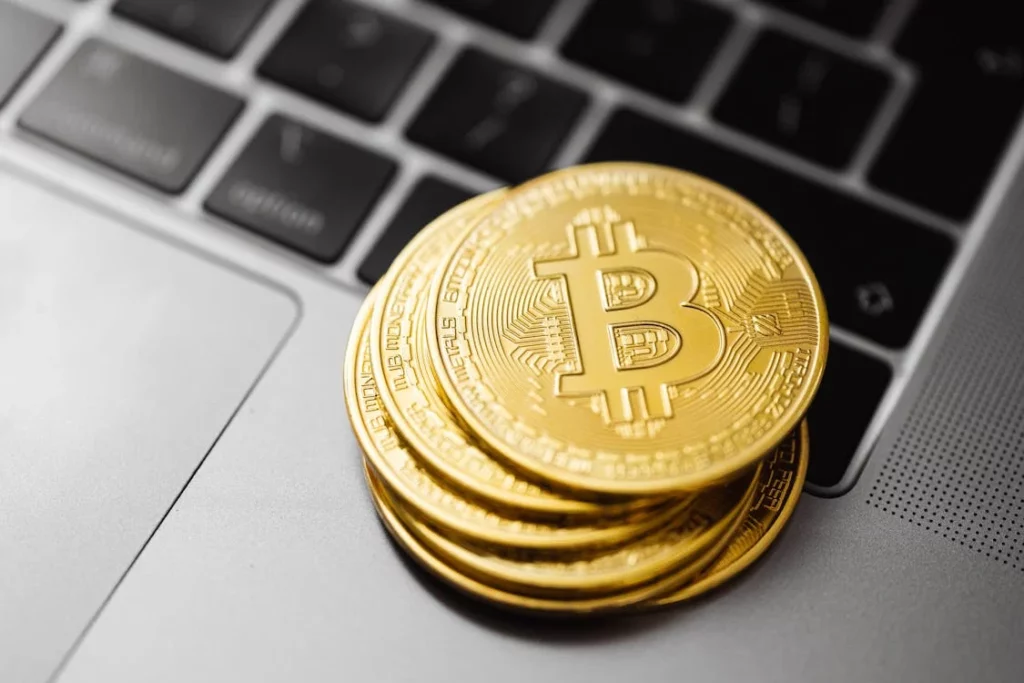 A picture of bitcoins on laptop